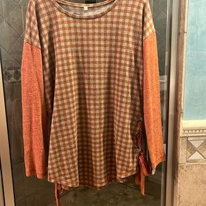 Women’s top with lace up bottom sides. Worn one time.  Outgrew